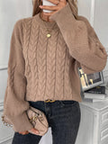Women's beige loose sweater with twist stitch pattern and round neck