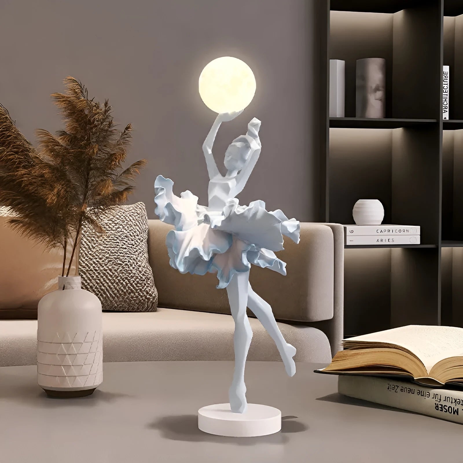 Small resin night light ornament in black gold colour with USB charging cable
