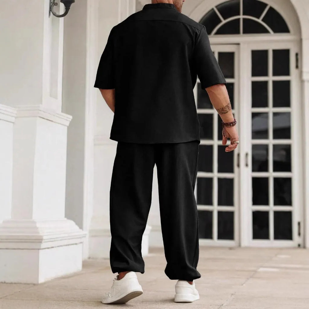 Men's casual apricot coloured cotton linen short sleeve shirt and trousers set laid flat.