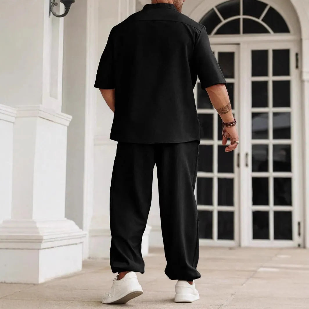 Men's casual apricot coloured cotton linen short sleeve shirt and trousers set laid flat.
