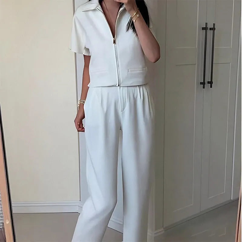 White loose-fit casual Damascus polyester top with short sleeves on a hanger.
