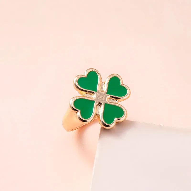 Four leaf clover ring in silver colour with enamel detailing on zinc alloy band, 17mm size