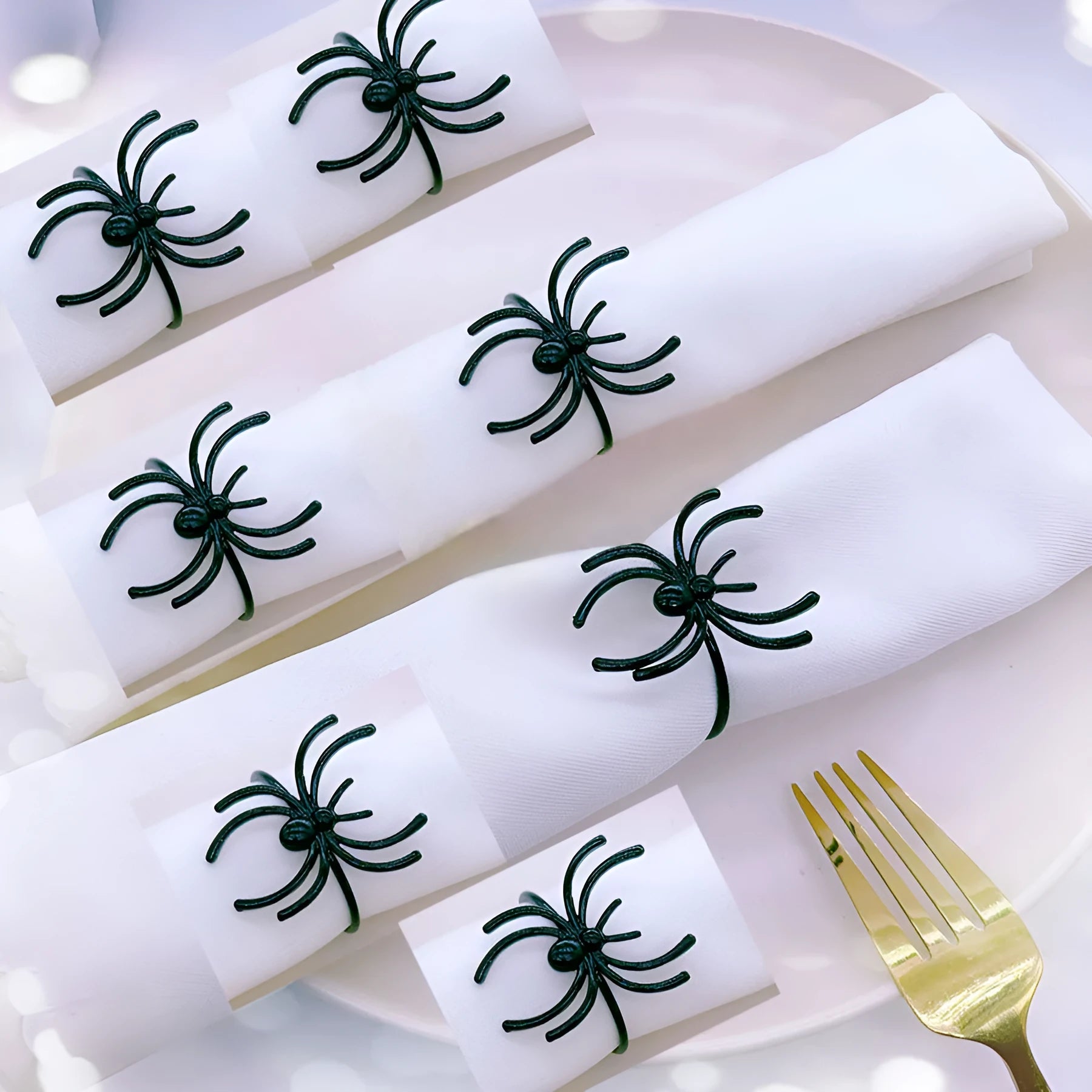 Set of six black spider Halloween napkin rings made from alloy material