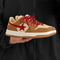 Brown women's lace-up platform sneakers with sequin details and a rubber sole.