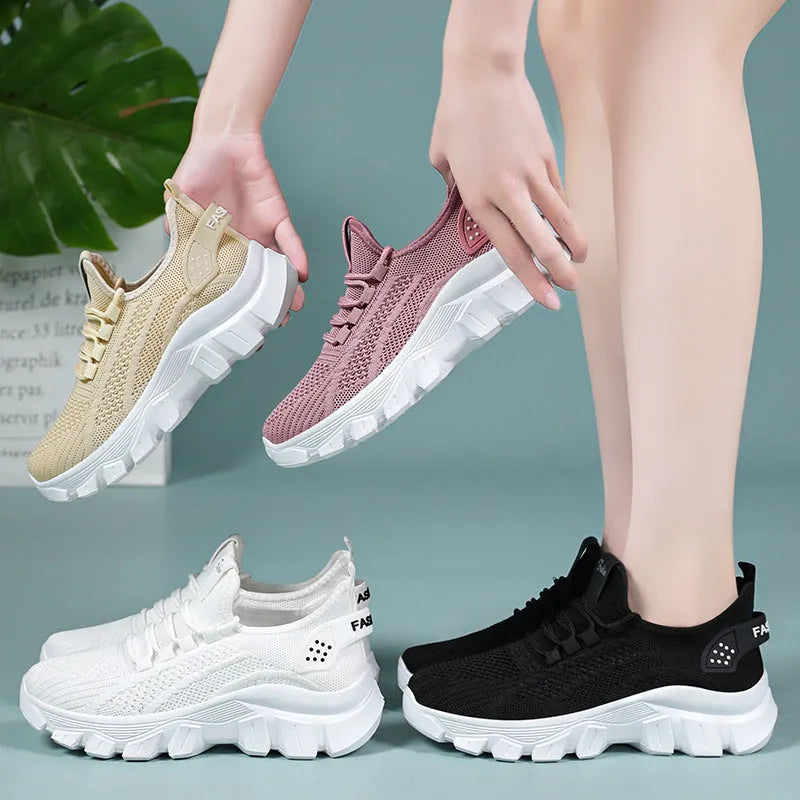 Women's white Flyknit running sneakers with thick PVC sole and lace-up front