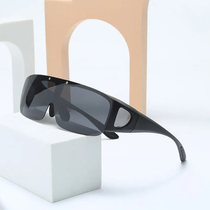 Polarized clip-on sunglasses with a one-piece frame shown in multiple lens colour options including black and grey