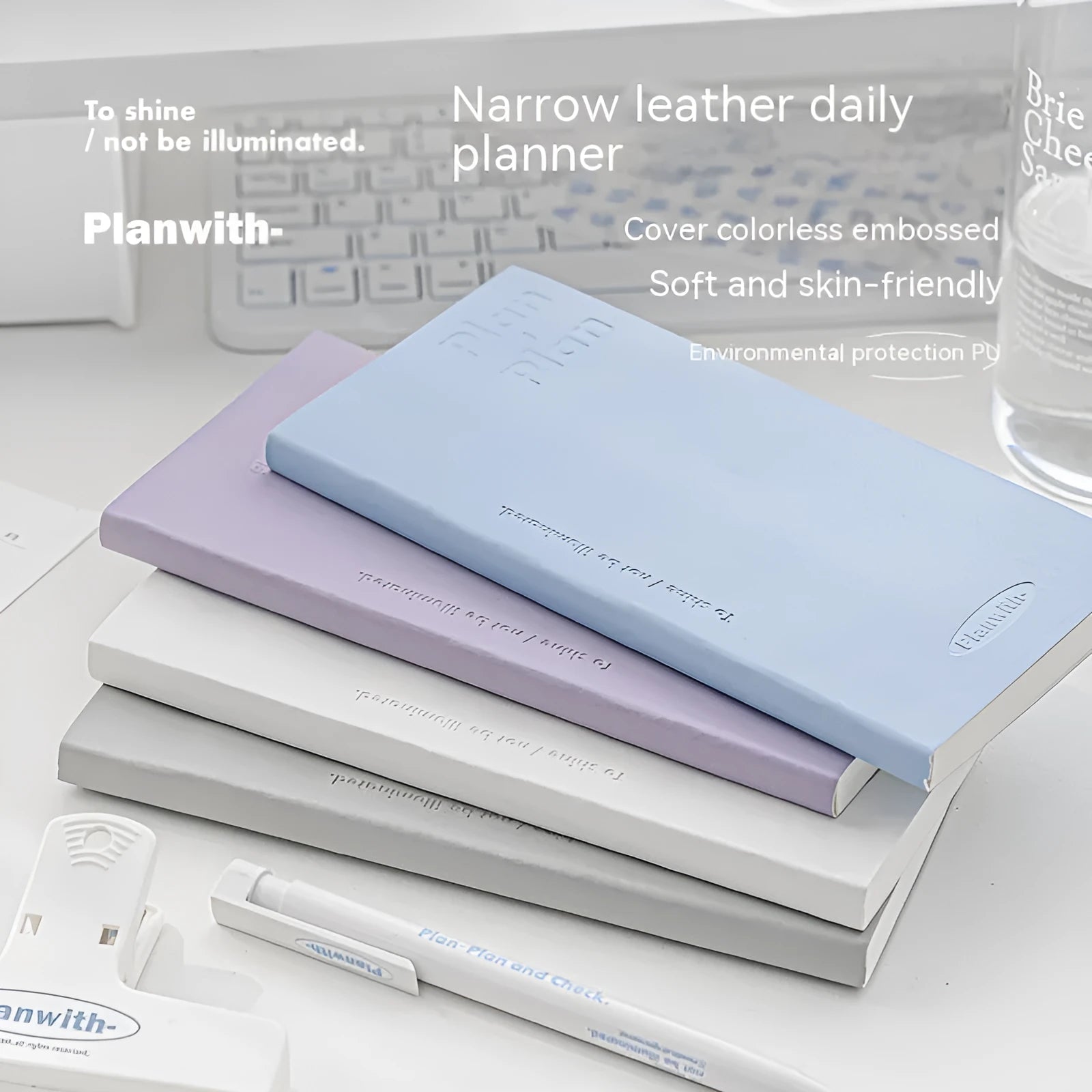 Embossed cover daily meter book notebook open on a desk, showing white 100g paper.