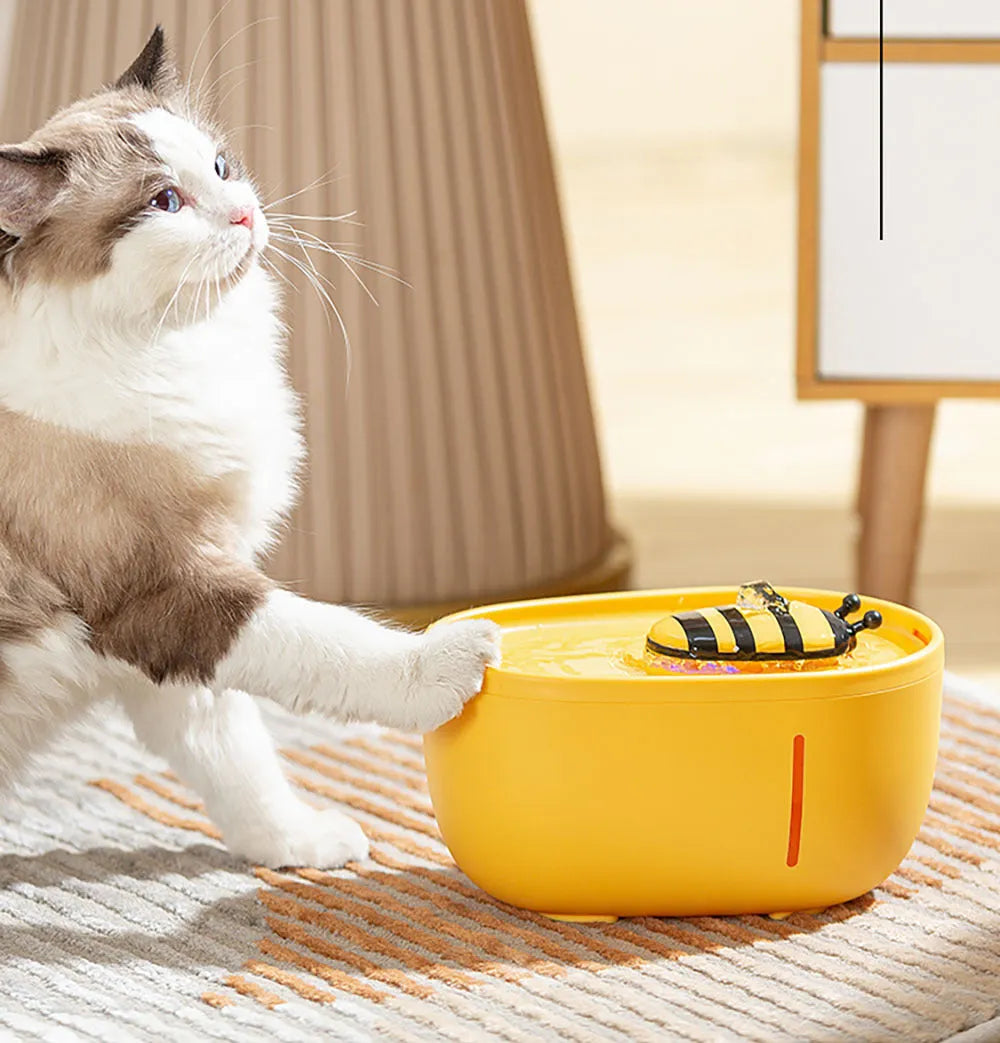 Yellow cat water fountain with filtration system, water level window, and USB pump