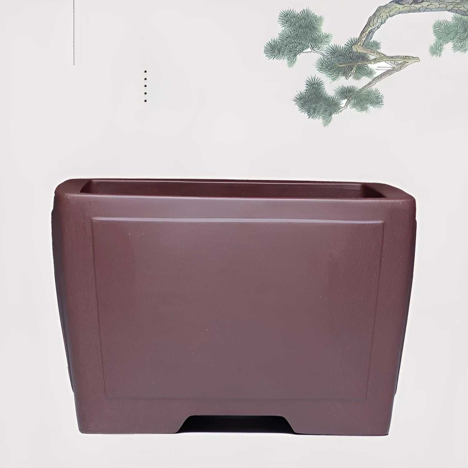 A square purple clay flower pot for succulents or bonsai plants on a tabletop.