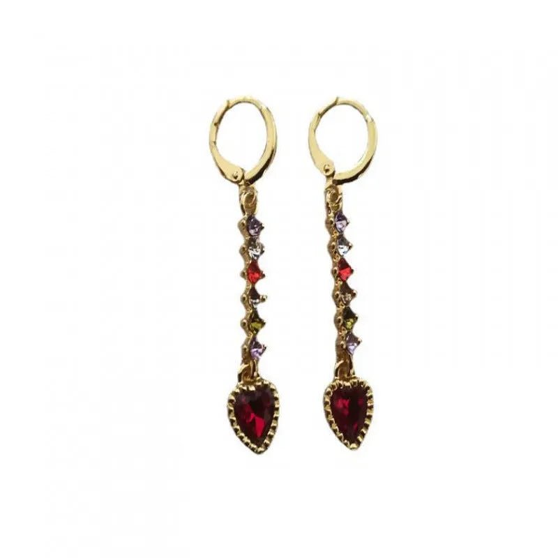 A pair of women's heart-shaped alloy earrings in gold or silver electroplated finish.