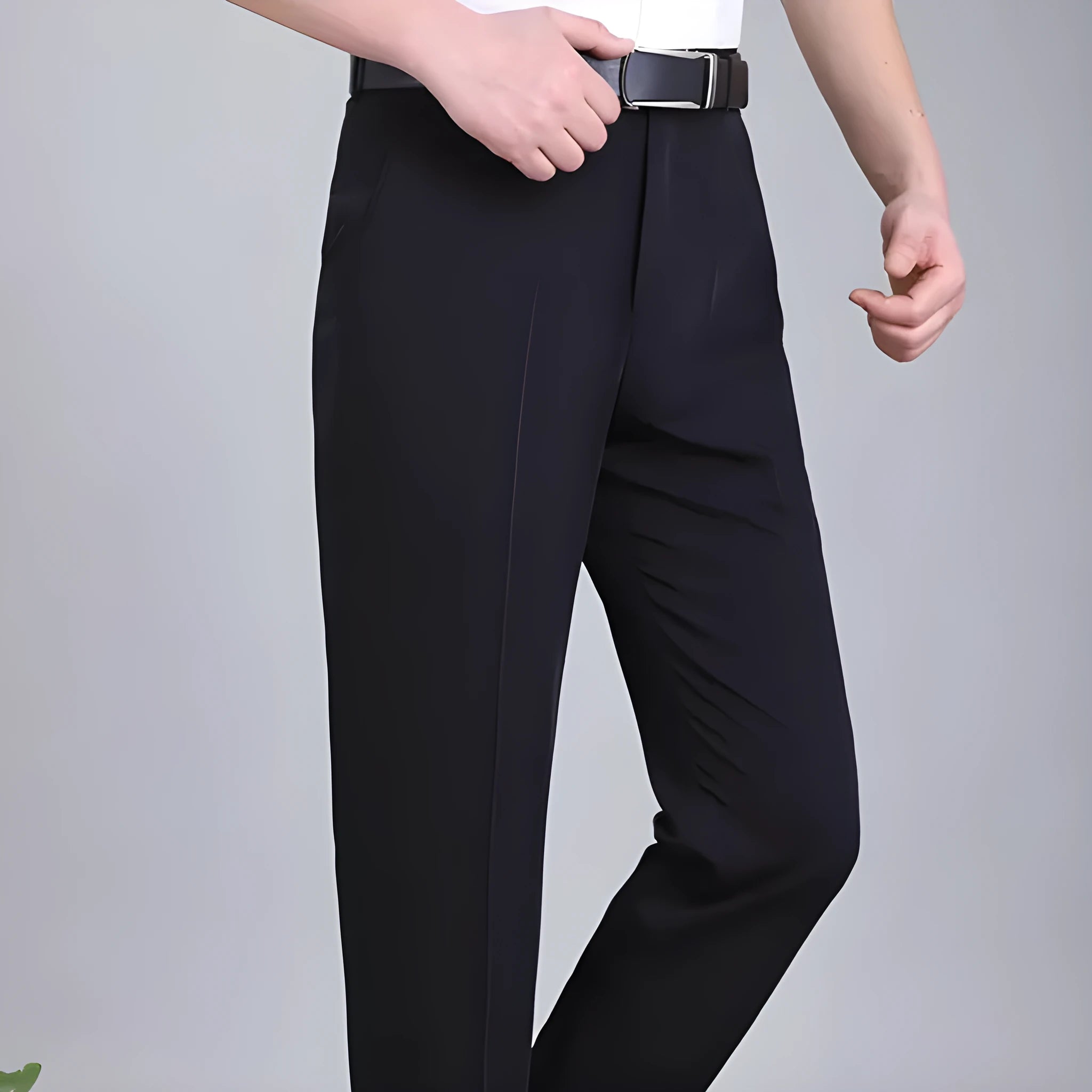 Man wearing dark blue straight-leg suit trousers with a high waist, made from a mulberry silk blend fabric.