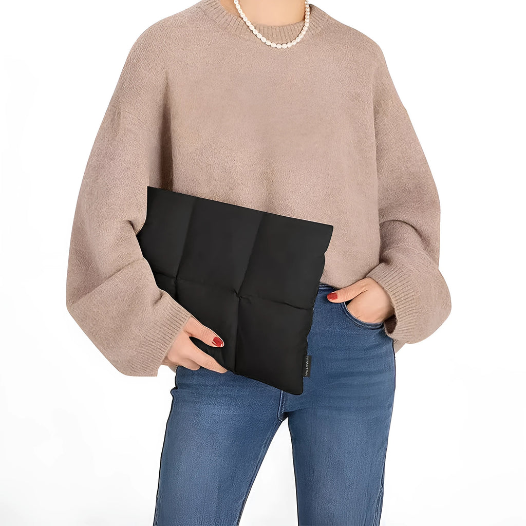 Soft fluffy polyester laptop sleeve for 13-15.6 inch devices in black or khaki with visible sewing thread
