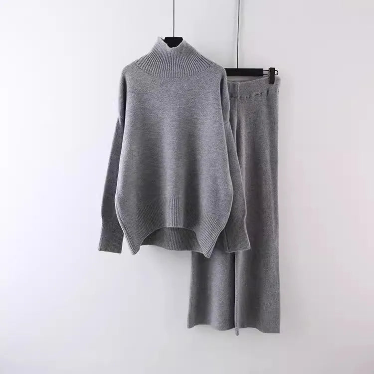 Women's beige acrylic sweater and wide-leg pants two-piece set laid flat.
