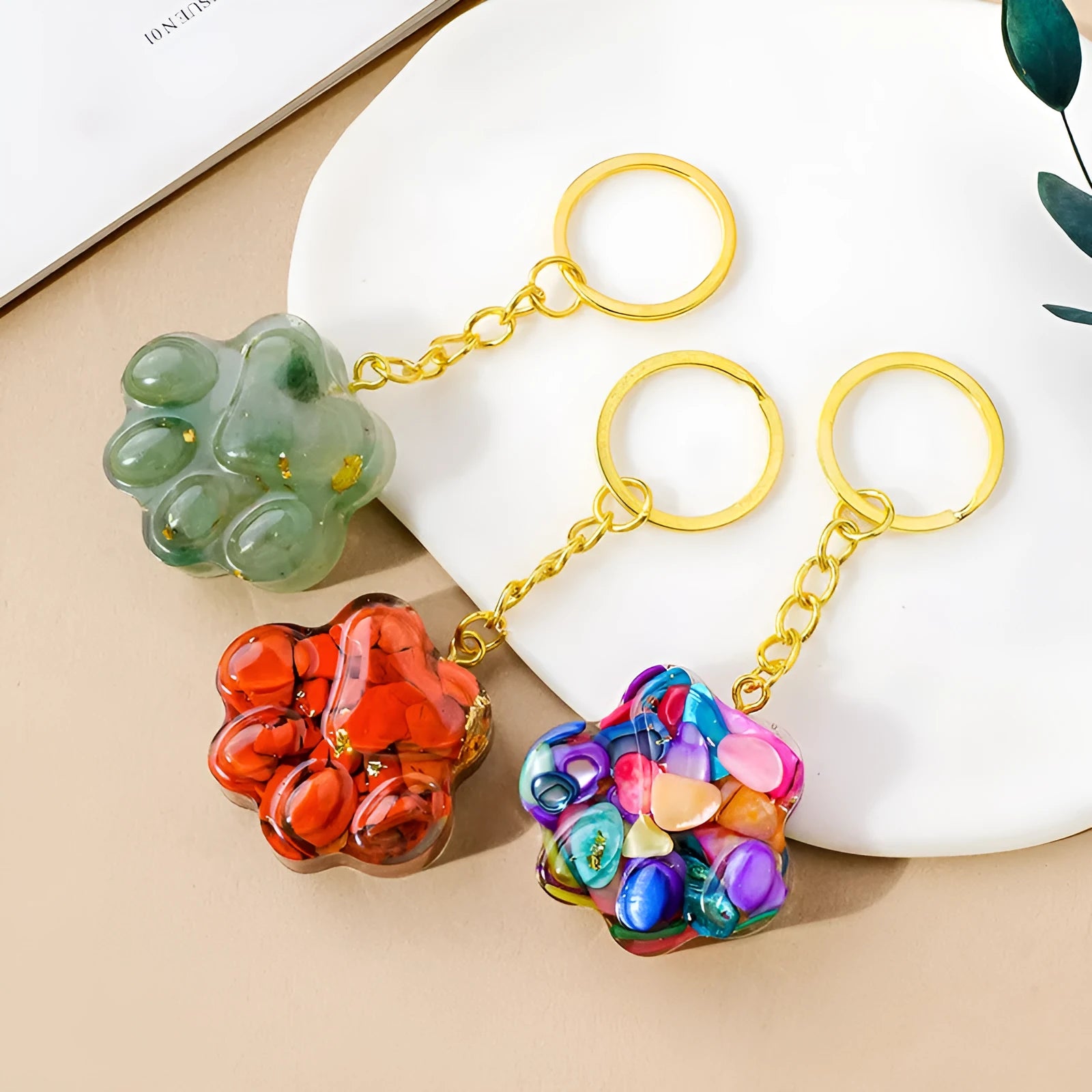 Small natural crystal cat's paw shaped pendant on a metal keyring, available in various crystal colours.