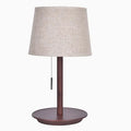 Walnut coloured solid wood table lamp with white cloth lampshade and black cable switch.