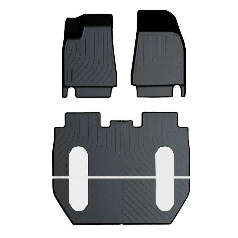 Custom rubber floor mats for Tesla cars with a textured TPE driver footrest section.