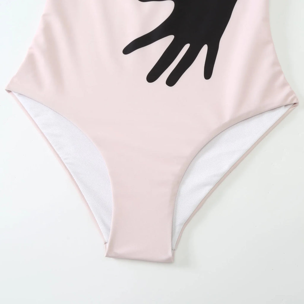 Women's patterned bikini swimsuit with a lightweight white tulle skirt attached.