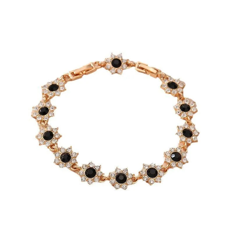 Floral-shaped zinc alloy bracelet with electroplated finish in gold and silver colour options.