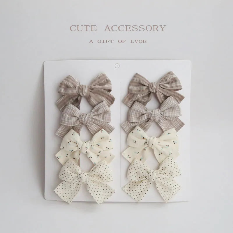 Children's eight-piece cloth bow hairclip set in dovetail shape with multiple colour options