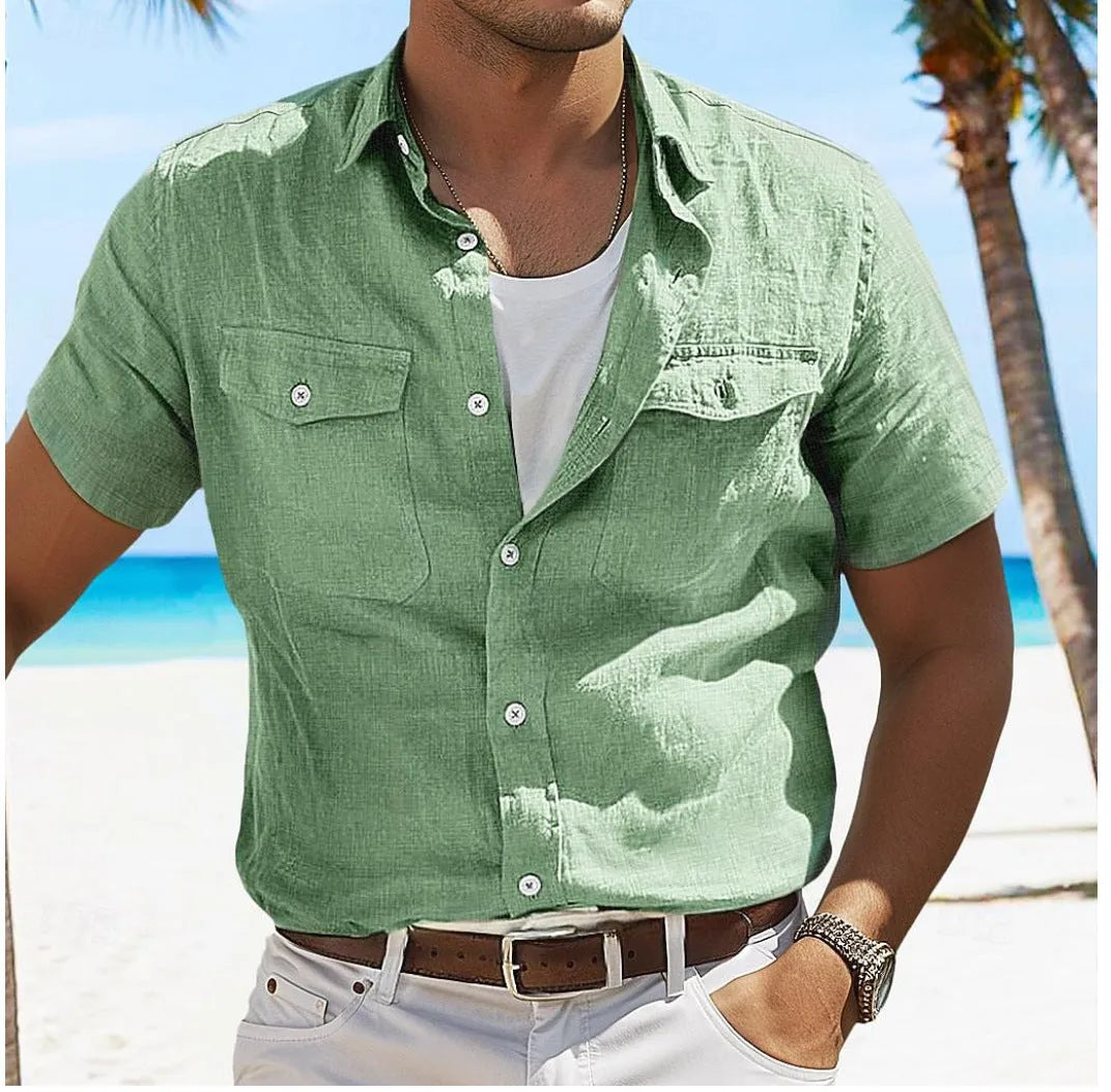 Man wearing a loose-fitting grey cotton cardigan-style shirt with long sleeves.