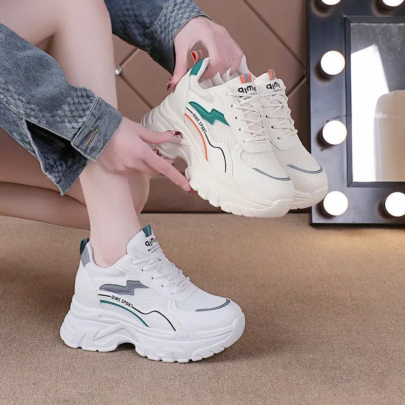 Women's white and beige dad shoes with cross straps and height increasing insoles