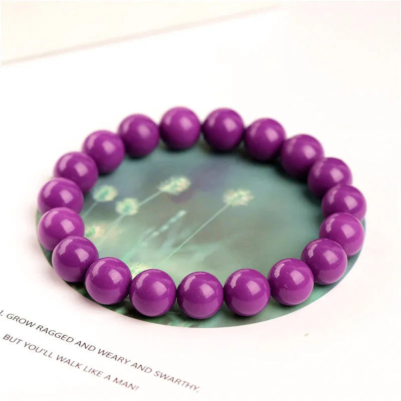 Jiuya polished crystal bracelet in 5A purple mica colour, showing single circle beads in one of three available sizes.
