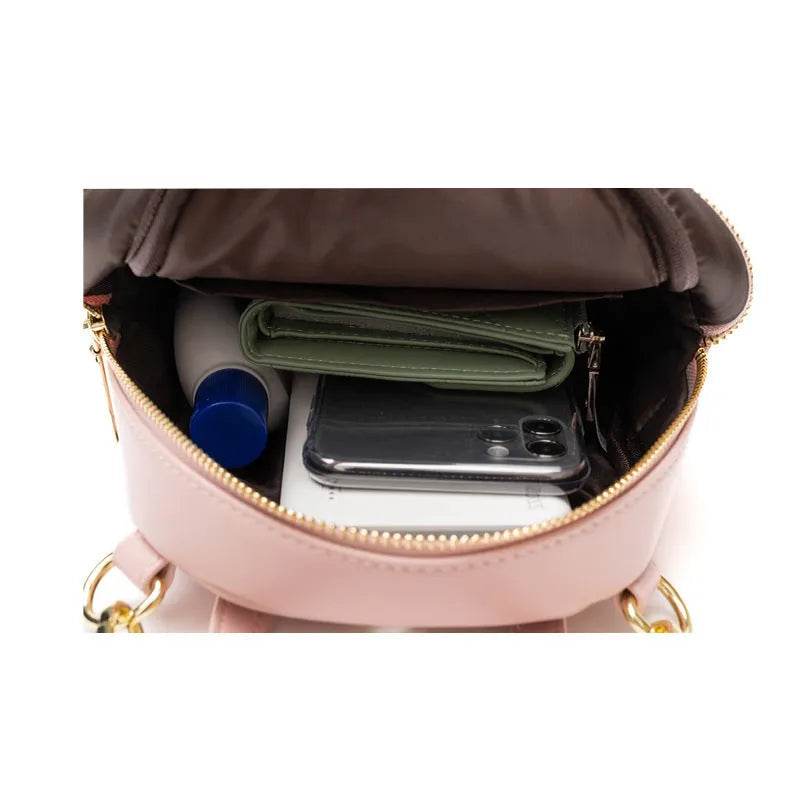 Soft PU mini backpack in multiple colours showing outer pocket and street style design