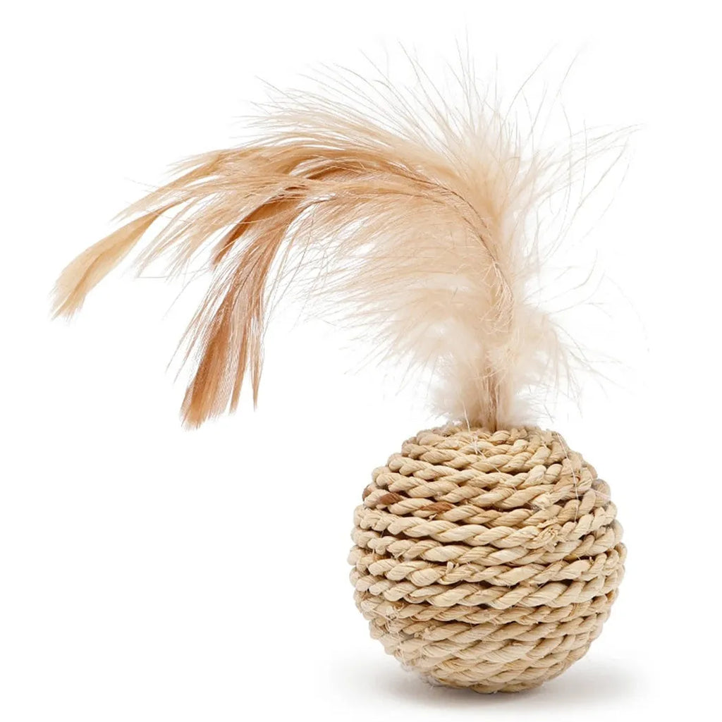 Two cat toys: a natural rattan ball with a bell and a colourful faux feather ball on a plain surface.