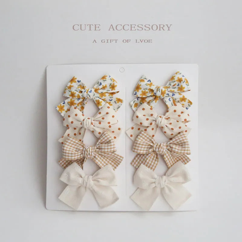 Children's eight-piece cloth bow hairclip set in dovetail shape with multiple colour options