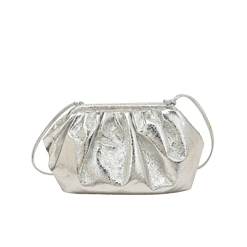 Shell-shaped shoulder crossbody bag with hair clip closure in rose red colour showing interior organisation compartments