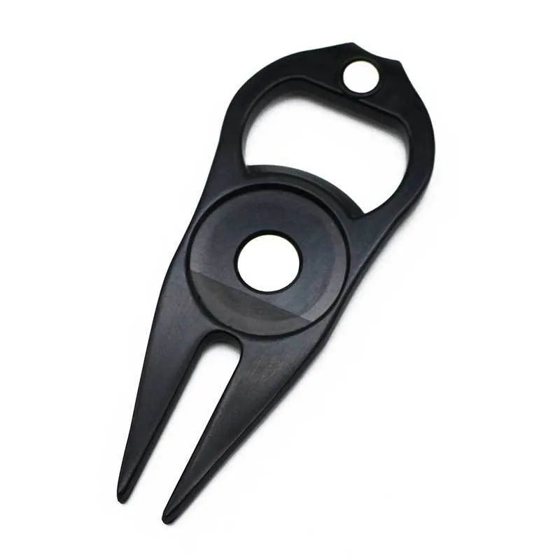 Zinc alloy golf ball yoke and bottle opener tool in black or green on a putting green.