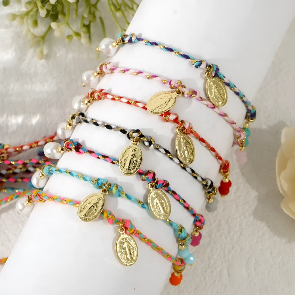 Close-up of a hand-woven colourful braided rope bracelet for women with a carrying strap tag.