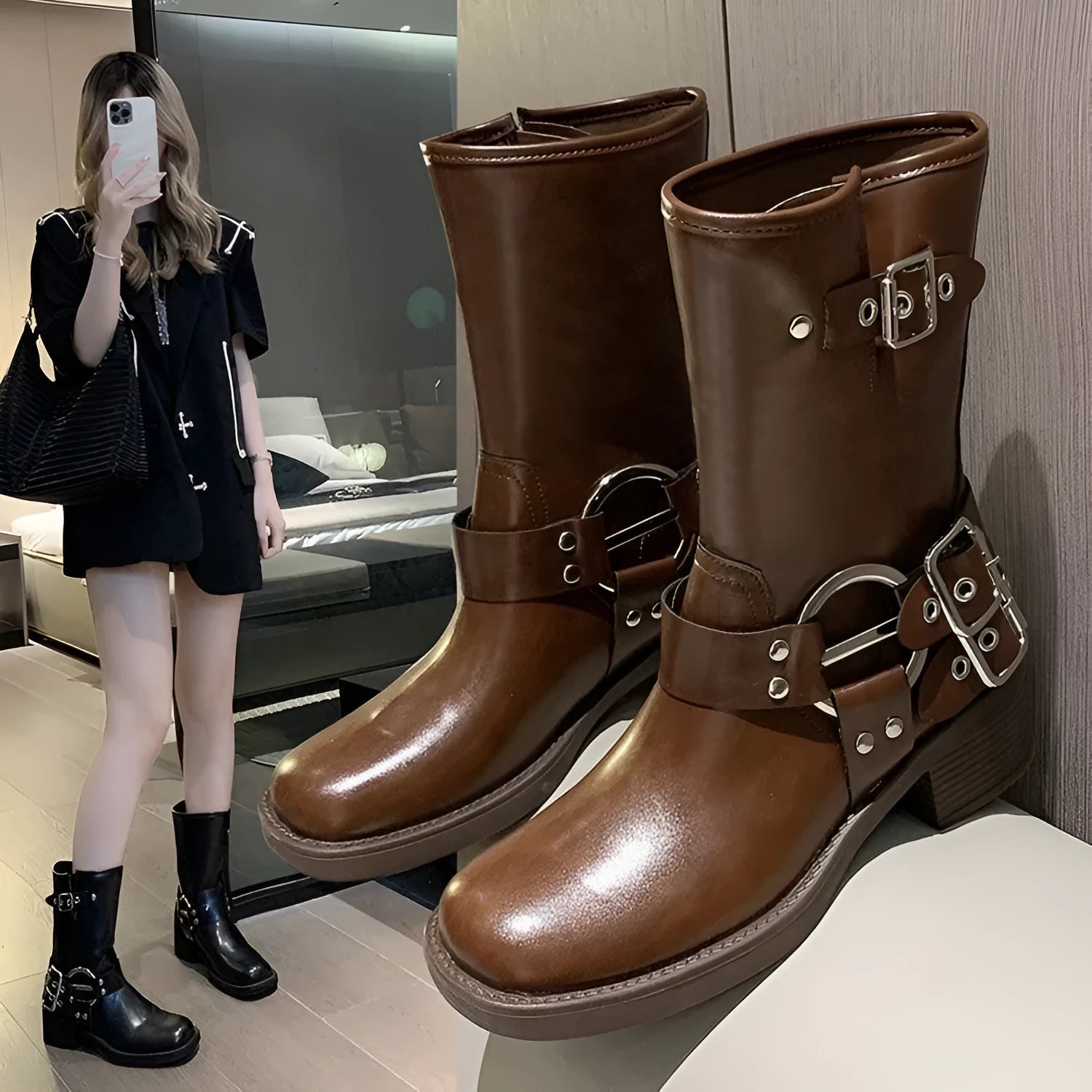 Women's black platform boots with mid-calf sock design and ankle buckle strap