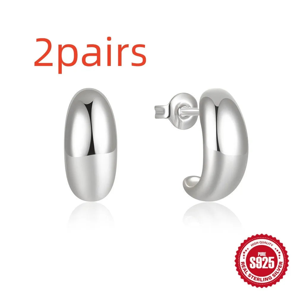 Sterling silver C-shaped geometric stud earrings with glossy electroplated finish