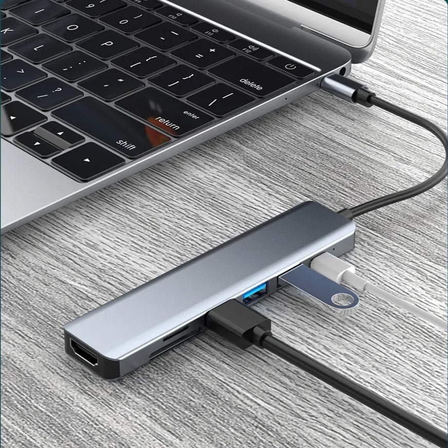 Seven-port Type-C USB expander hub with HDMI, USB ports, SD slots, and 0.145m cable for laptop connectivity