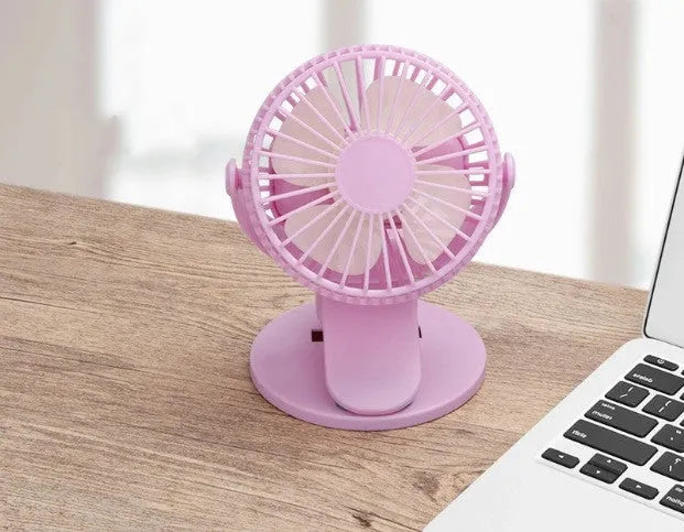 White USB rechargeable brushless clip fan attached to a desk edge