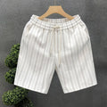 Men's black and white striped fleece-lined casual shorts showing double-layer waistband and straight-leg cut