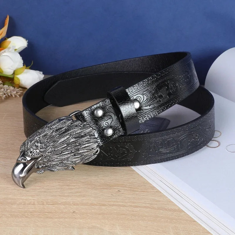 Men's black imitation leather belt with a detailed silver alloy cow head buckle and pin buckle fastening.