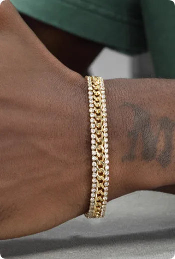 Gold tennis bracelet with stone detailing on titanium steel band