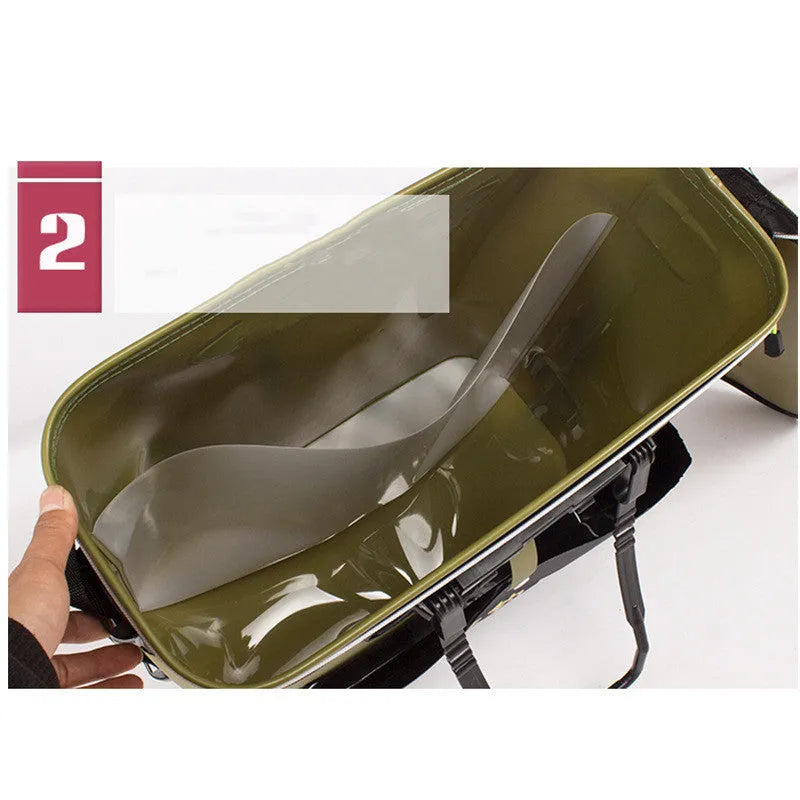 Foldable blue EVA fishing box live fish bucket measuring 42x42x21cm on a grassy bank