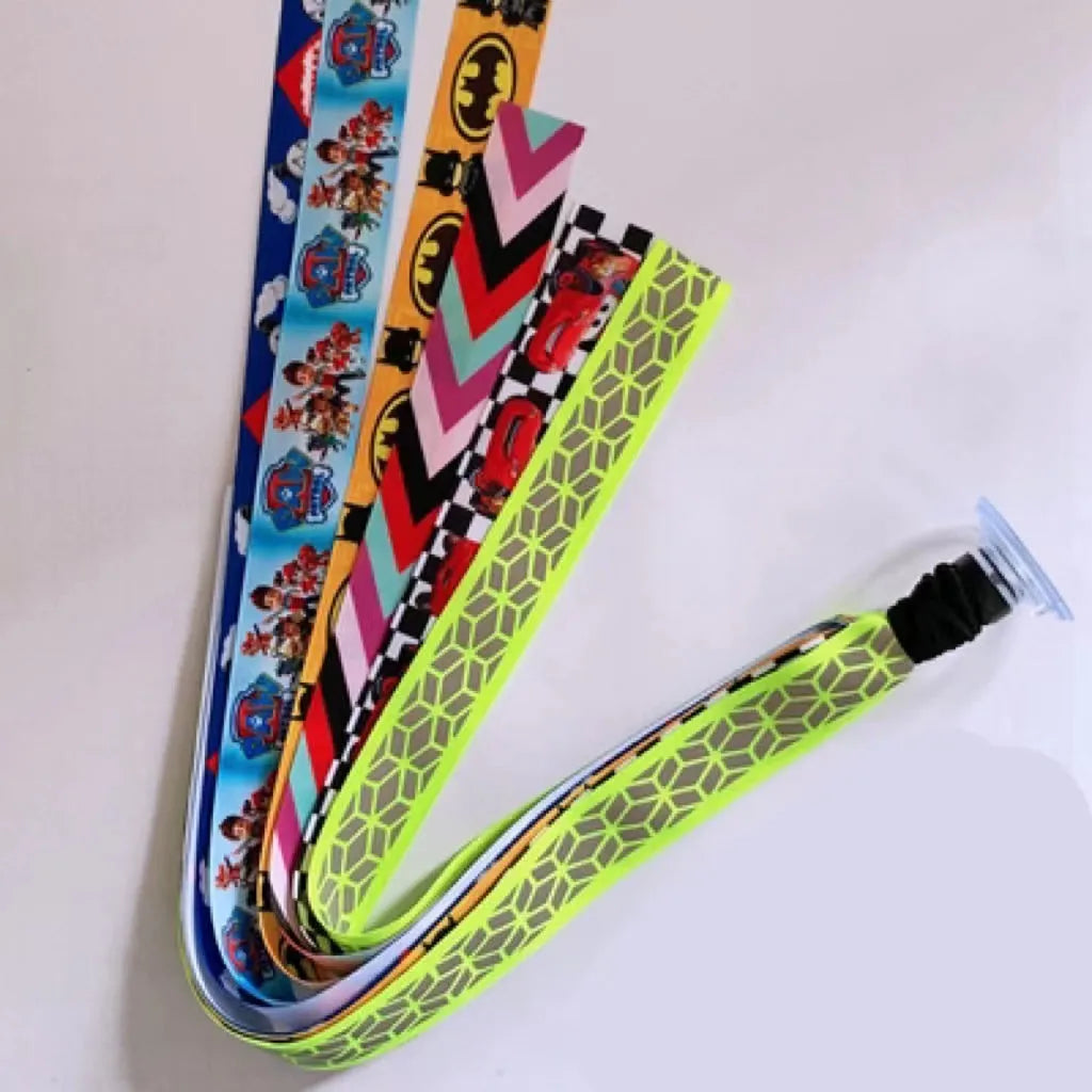 Close-up of a colourful decorative ribbon streamer attached to a child's helmet for roller skating or skiing.