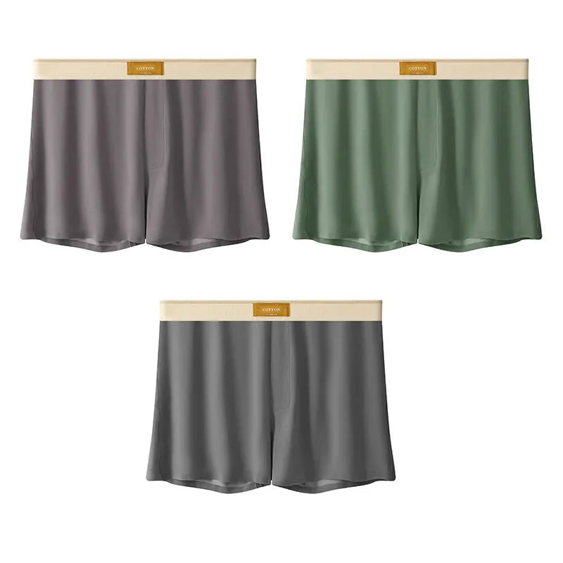 Pack of three pairs of men's solid colour ice silk underwear on a white background.