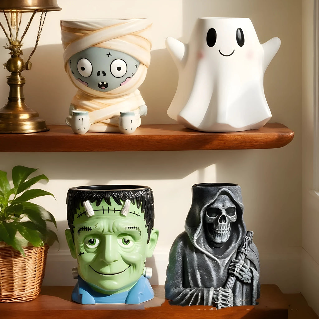 Four Halloween cartoon character resin flower pot decorations with hand-painted details
