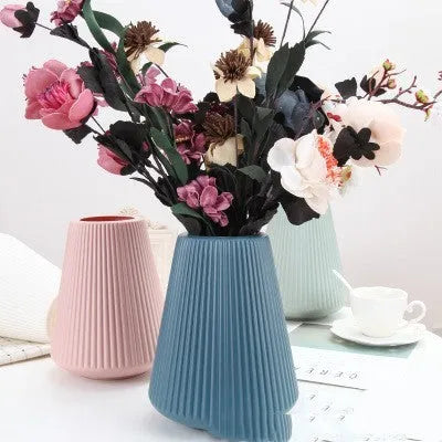 Melamine plastic decorative vase 16cm diameter in blue colour on wooden desktop