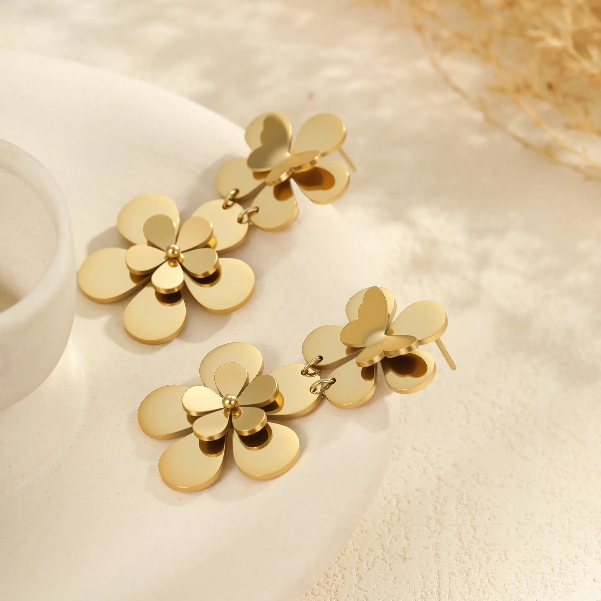 Gold flower butterfly stainless steel earrings with 18K electroplated finish and floral design elements