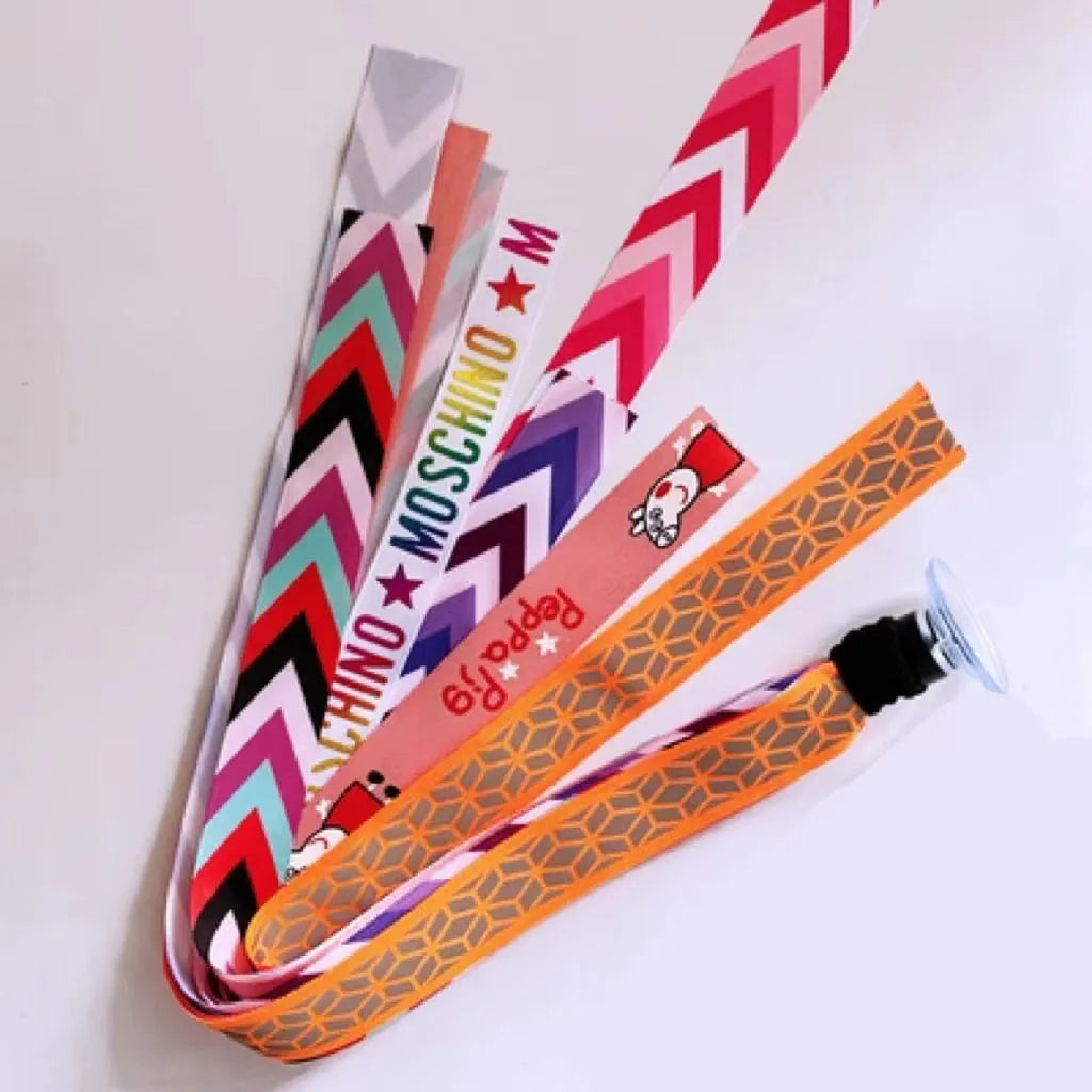 Close-up of a colourful decorative ribbon streamer attached to a child's helmet for roller skating or skiing.