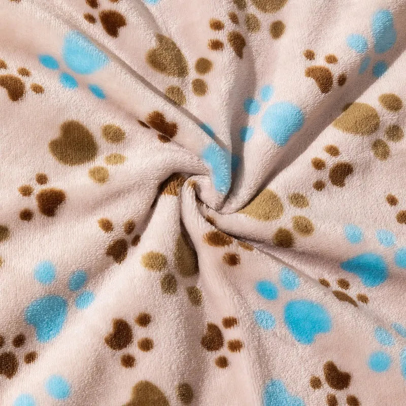 Blue cartoon dog pattern double-sided flannel pet blanket shown in a dog crate.
