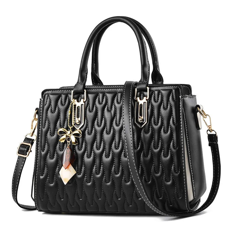 Women's large polyester messenger bag in black with shoulder strap and external pockets.