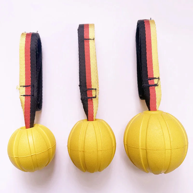 EVA floating pet tetherball toy in yellow and camouflage colours with string attachment