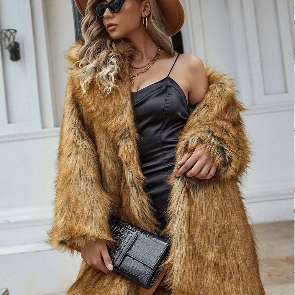 Yellow loose-fitting women's faux fur coat with regular sleeves on a hanger